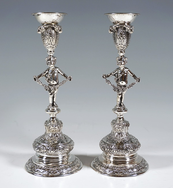 Pair of silver candlesticks with putto and rams heads pair of silver candlesticks with cupid and rams heads Eduard Gottsleben Vienna ca 1890